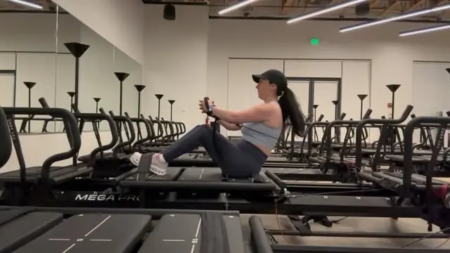 Izy demonstrating a loaded carriage move on the Megaformer in the studio